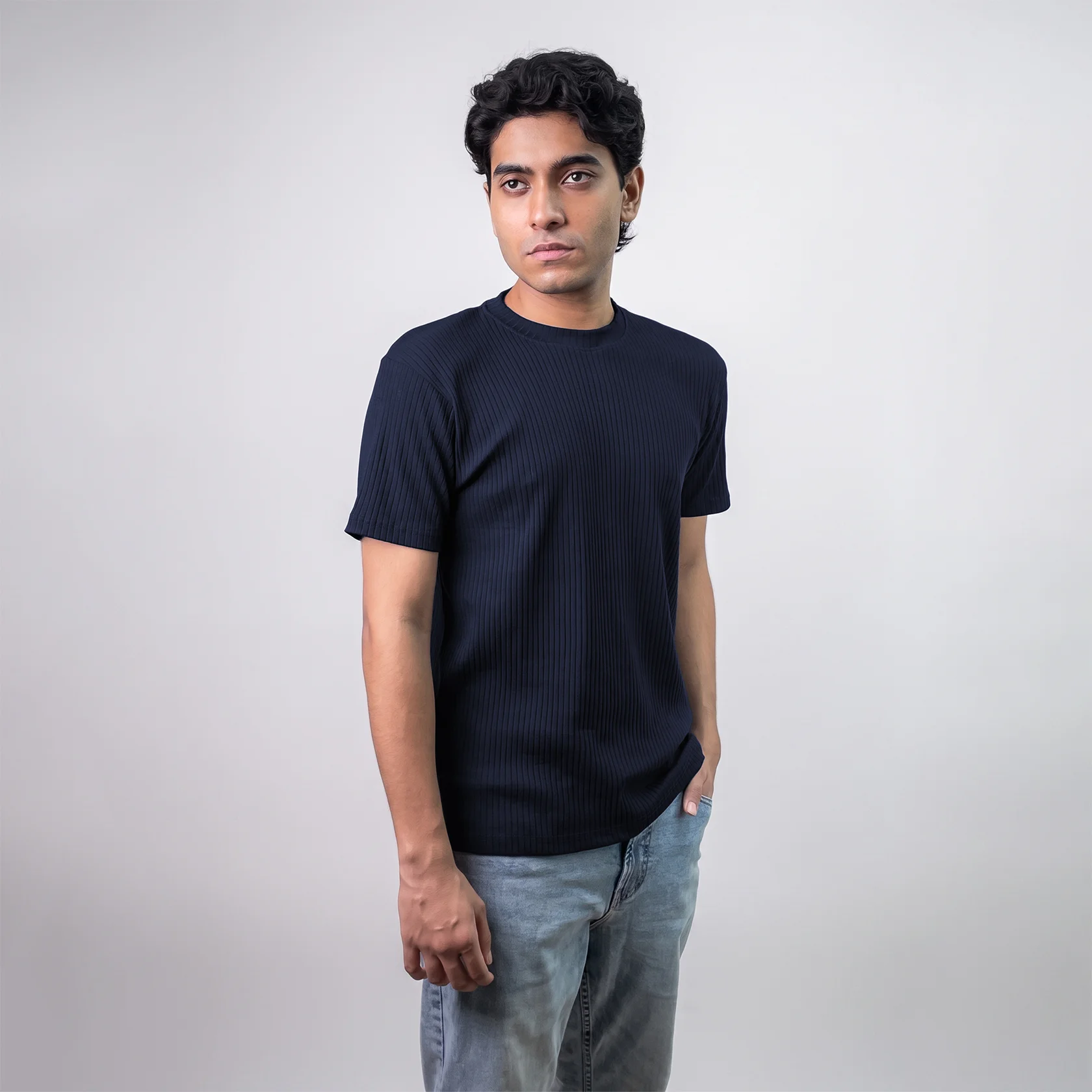 Model wearing navy blue textured t-shirt