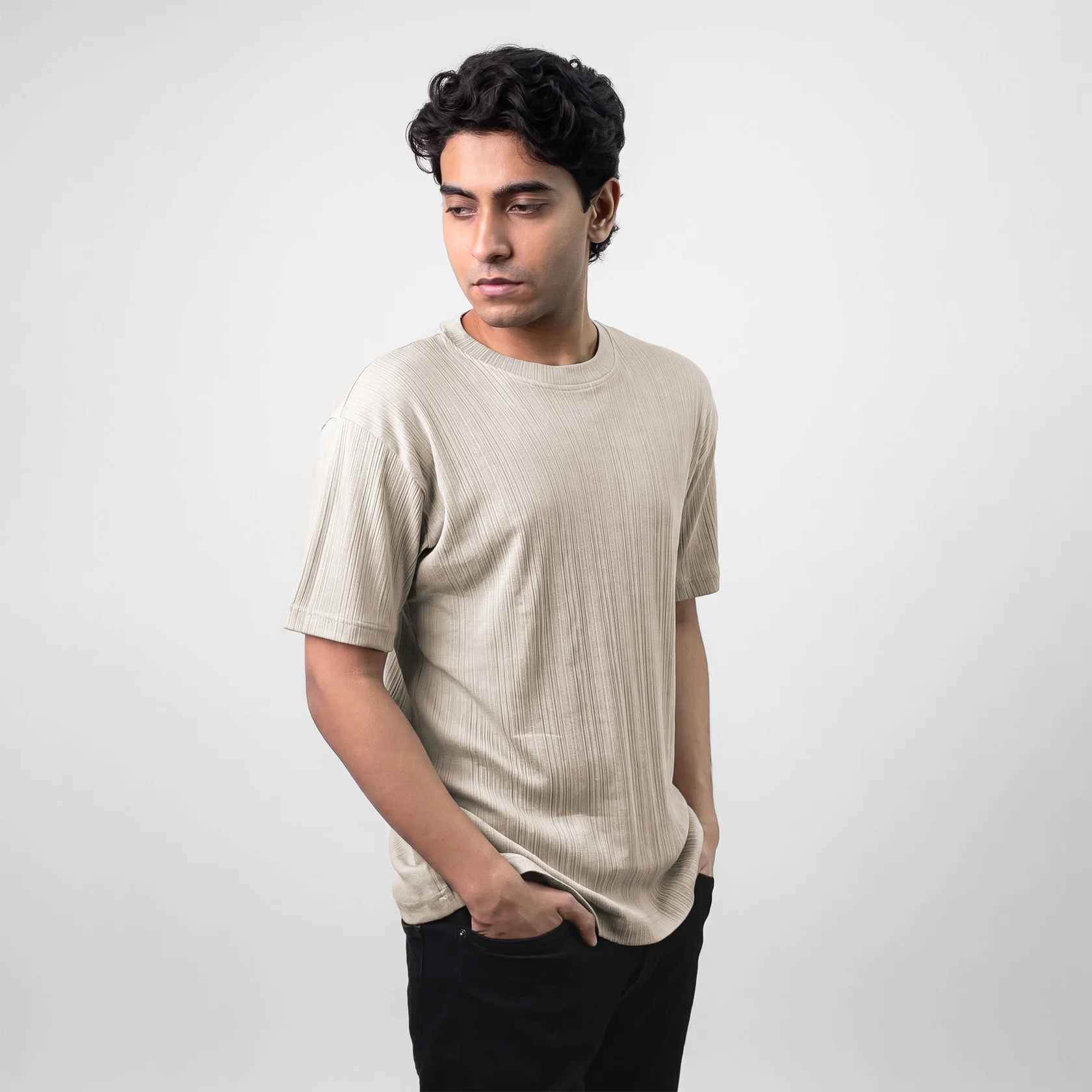 Model wearing Textured Crewneck T-shirt in Bluish grey color- relaxed fit and breathable